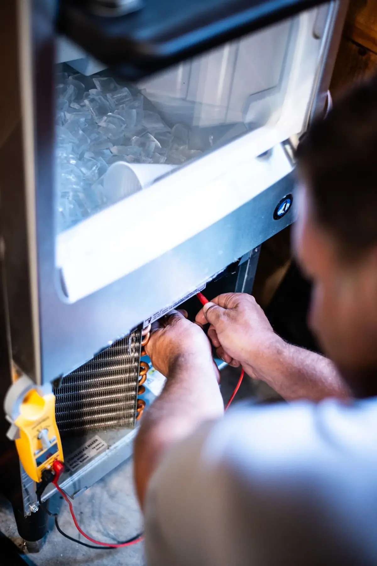 Close-up commercial refrigeration repair and electrical diagnostics