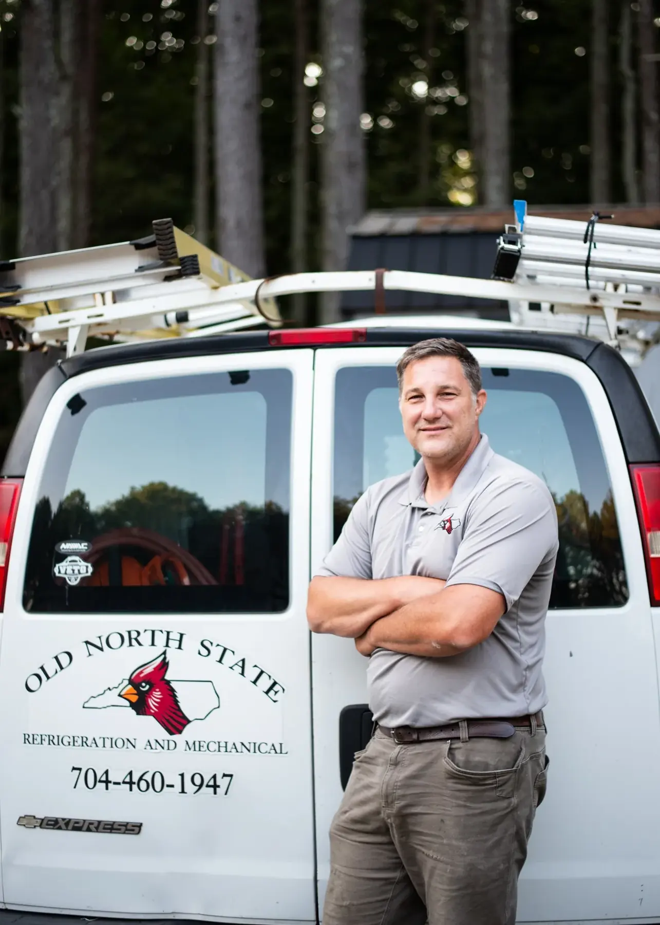 Turner Beam standing at the back of the Old North State Refrigeration and Mechanical service van