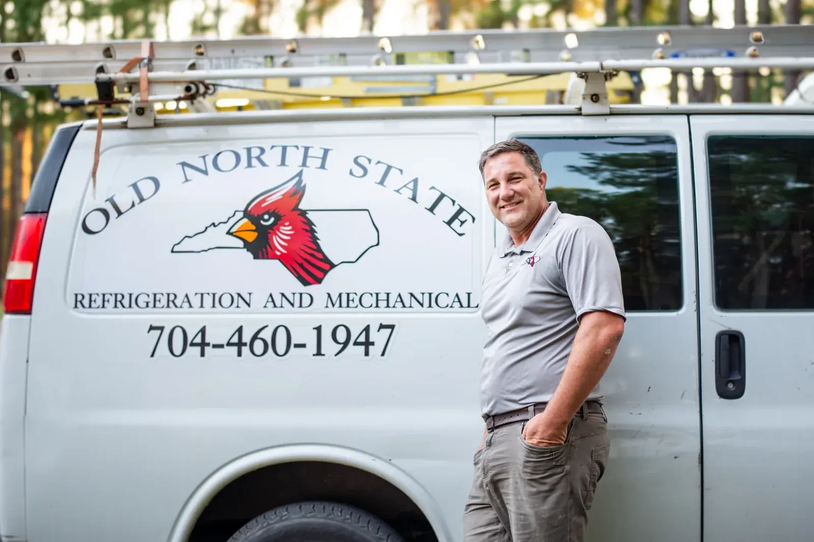 Turner Beam standing beside the Old North State HVAC service van in Cherryville NC